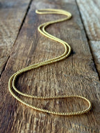 Gold glass seed bead necklace handmade on rustic wood, Seed and Soul artistry jewelry