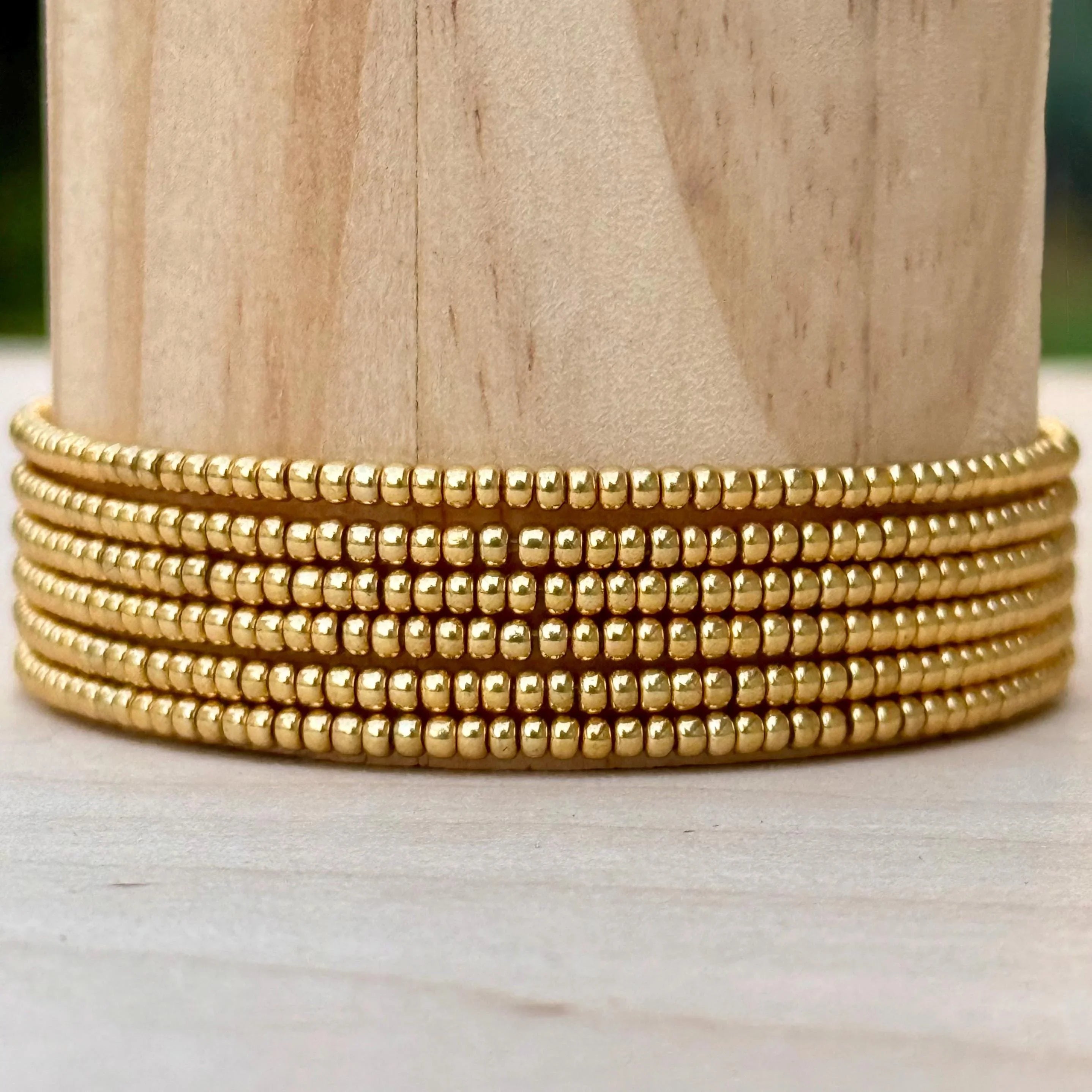 Handmade gold glass seed bead wrap bracelet on wood, Seed and Soul artistry jewelry