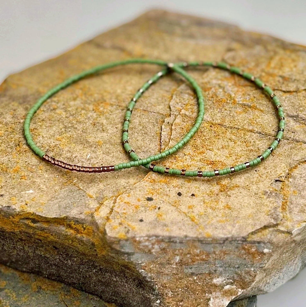 Handmade green glass seed bead bracelets on stone, Seed and Soul artistry jewelry