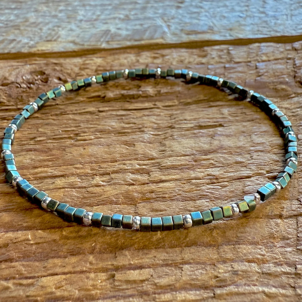 Handmade glass seed bead bracelet with metallic square beads on rustic wood, Seed and Soul artistry