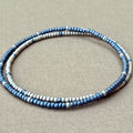 Handmade blue and silver glass seed bead bracelets on beige fabric, Seed and Soul artistry