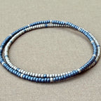 Handmade blue and silver glass seed bead bracelets on beige fabric, Seed and Soul artistry