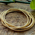 Handmade gold glass seed bead wrap bracelet on rustic wood, Seed and Soul artistry jewelry