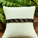 Handmade glass seed bead bracelet in black and bronze on display, Set of 4 bracelets, Seed and Soul artistry jewelry