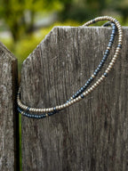 Handmade glass seed bead bracelets in blue and silver by Seed and Soul artistry on weathered wood