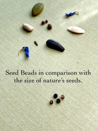 Seed and Soul handmade glass seed beads and natural seeds on textured fabric background
