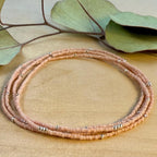 Handmade pink glass seed bead bracelet with silver accents on wood, Seed and Soul artistry